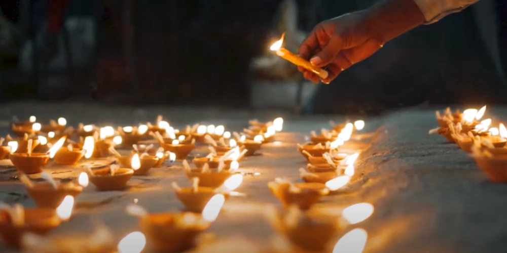Happy Diwali 2022, lighting diyas or lamps on diwali